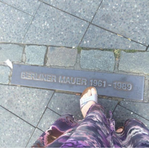 wall Berlin foot feet dress down sidewalk mauer Germany history marker toes division